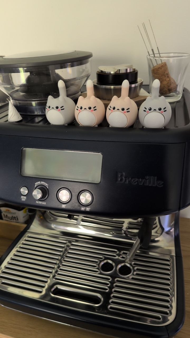3D printer working through the night with a cat fidget model nearby